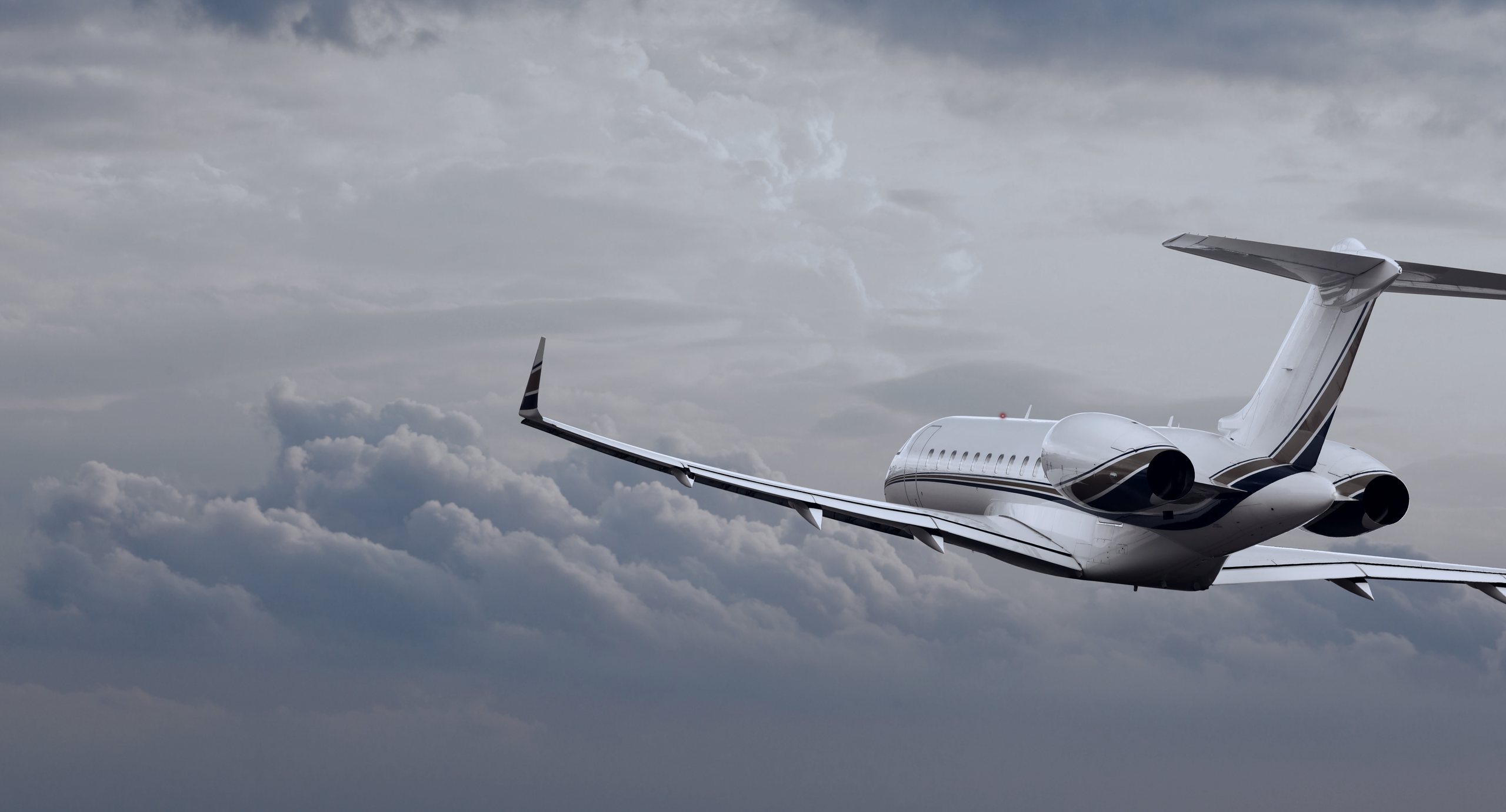 A private jet in flight at blue hour