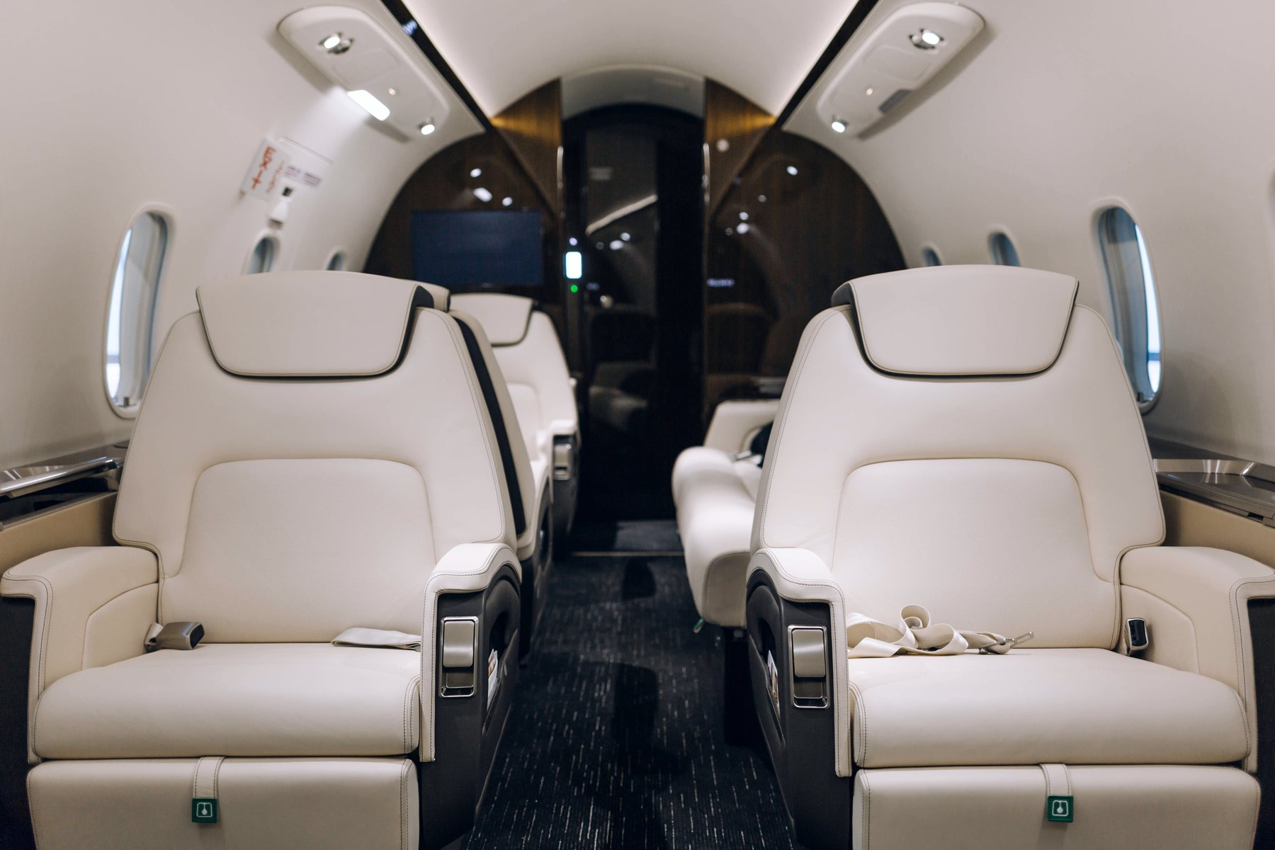 Private jet cabin with cream leather seating